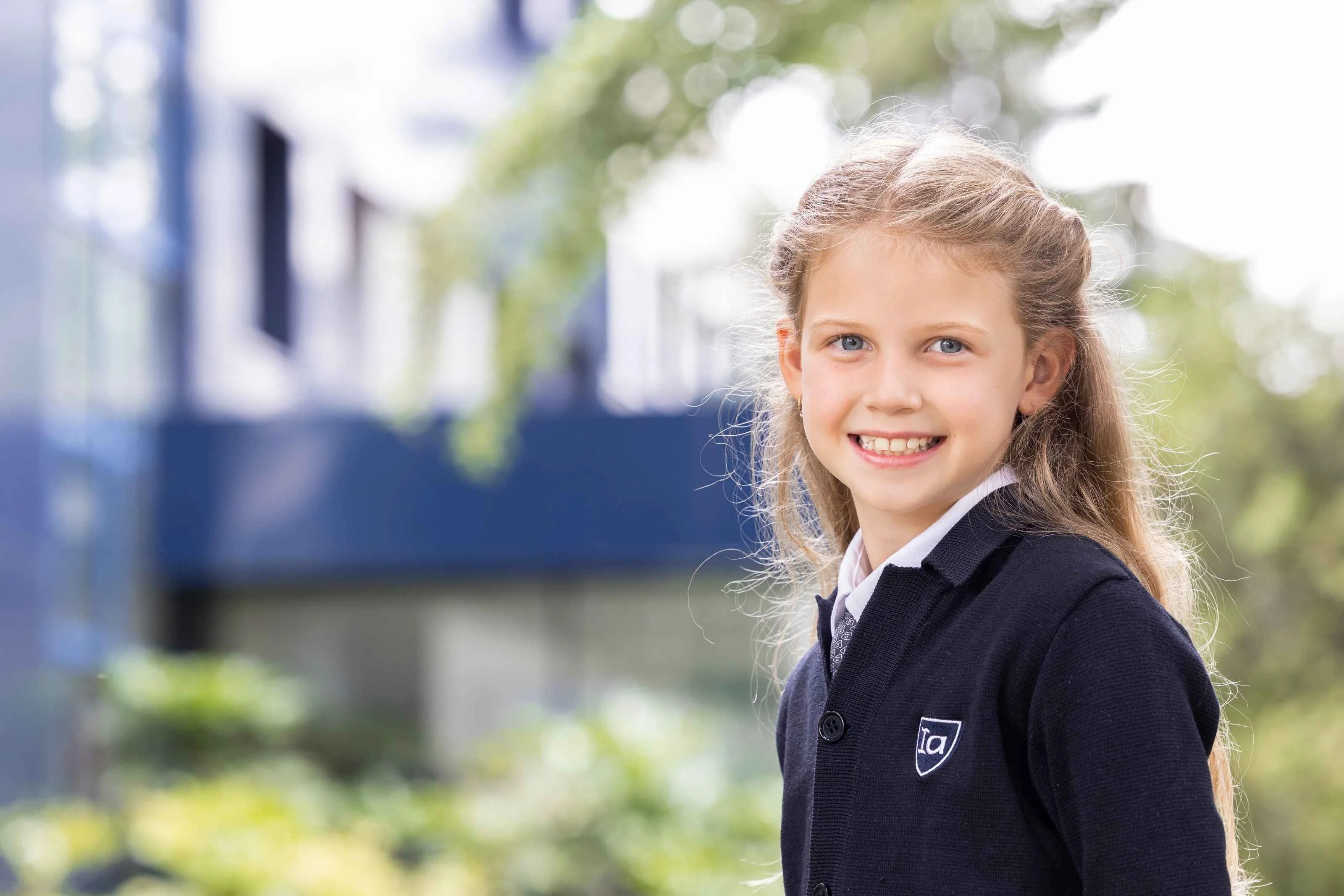 Student in uniform smiling 