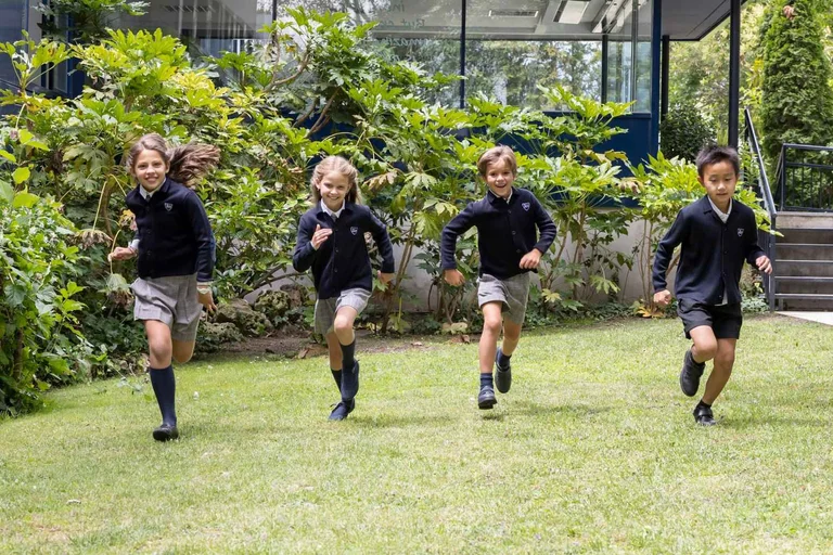Students running in the schoolyard