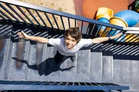 Student smiling in the stairs