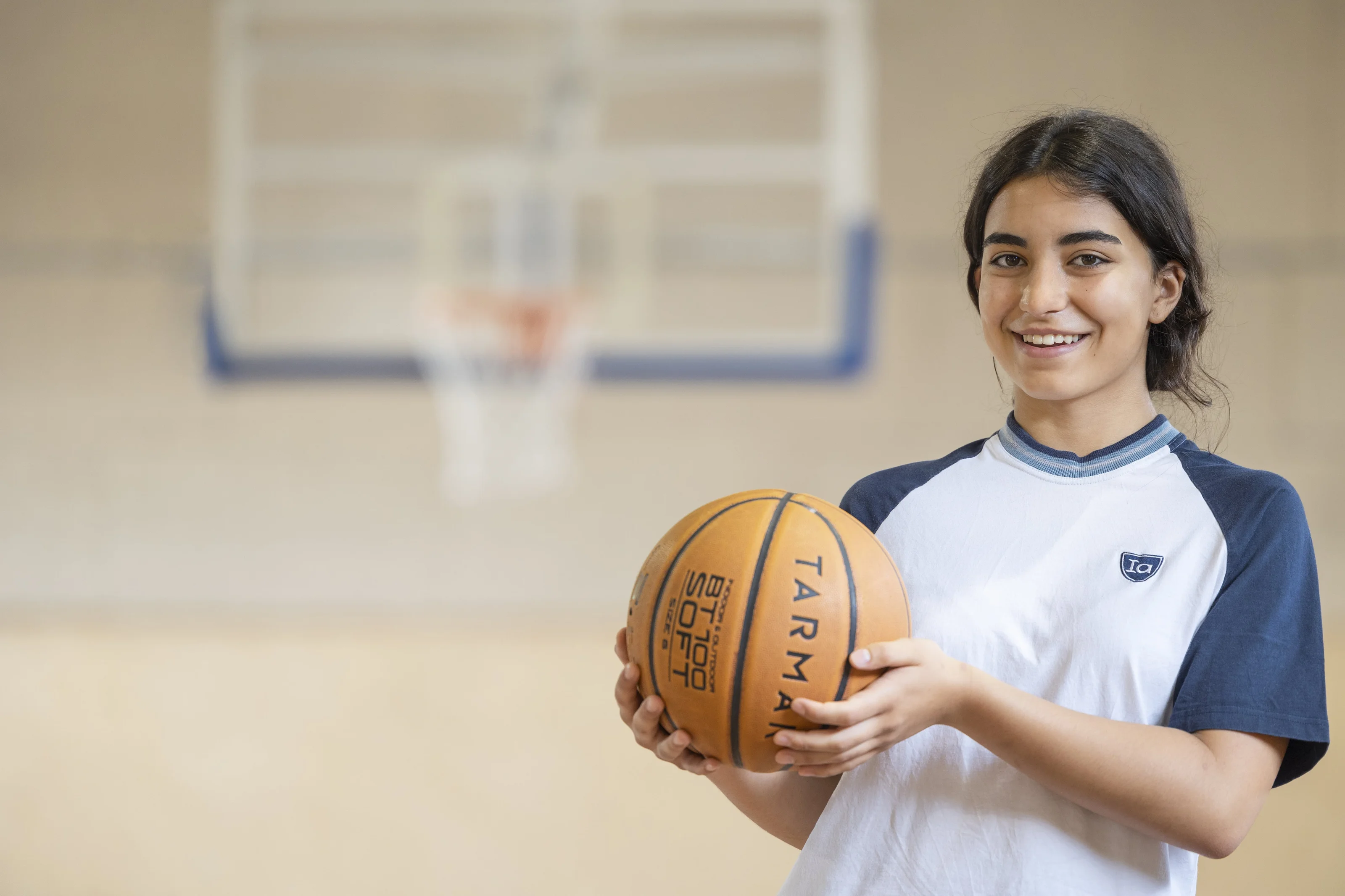 Basketball player holding the ball 